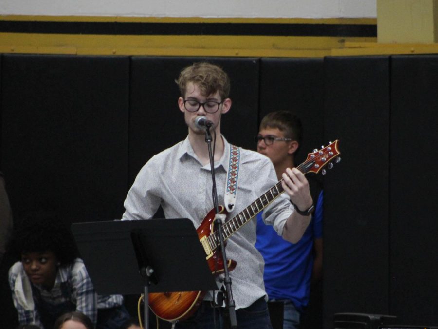 Senior Logan Potter sings and plays guitar in the Round-Up band.