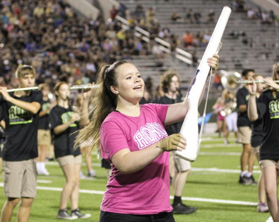 Senior captain Amberly Schell has liked color guard more than she thought she would when she joined four years ago. 