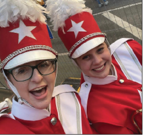 Sarah Beth Johnson and Jordan Tolleson march in the Macys Thanksgiving parade.
