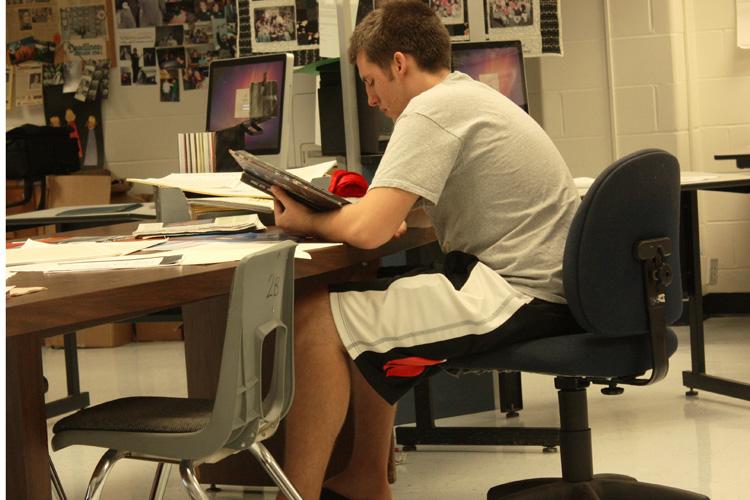 Yearbook editor Jon Lanford looks at ideas for this years book.