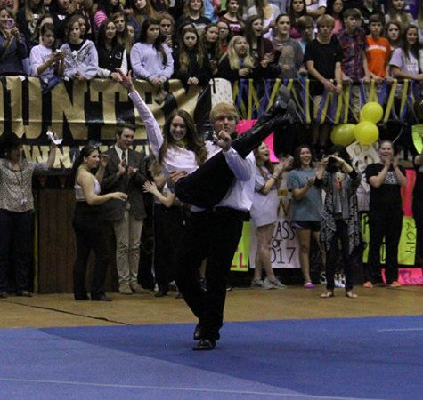 Mr. Raider RD Wegmann dances with his partner, Raider nominee Georgia DuBose at the Round-Up Assembly.