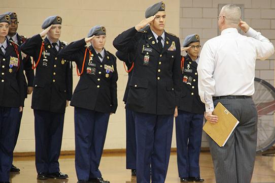 JROTC Executive Officer Austin Laughlin salutes the inspector at the JROTC inspection Dec. 9. The inspection is usually in April. In spite of the early date the group met requirements with a satisfactory score.