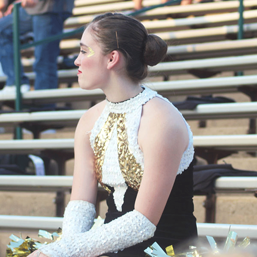 After the Halftime performance at the Abilene Cooper football game, junior Payton Talley arrives before her teamates on Aug. 28, 2014.