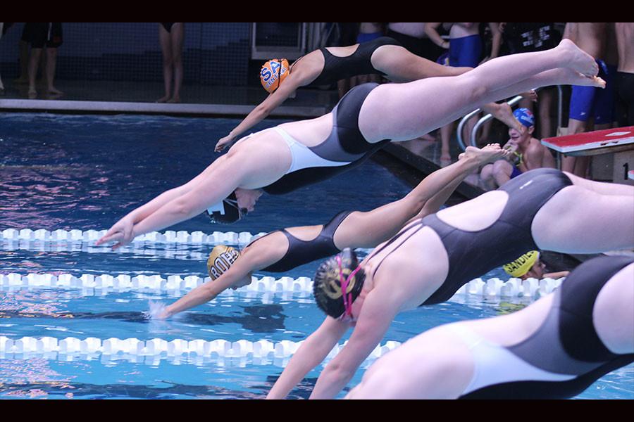 Cheyenne Garcia dives in first to the pool at the Abilene Inventational Meet on Saturday, Oct 18, 2014. She placed 12th out of 61, with a time of 1:07.76. She gained a point for the Rider swim team.