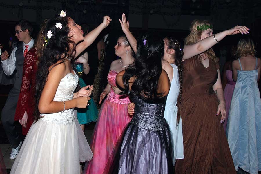 Junior Karla Gonzalez dances with her best friend Karla Alvarado in the middle of the dance floor at prom