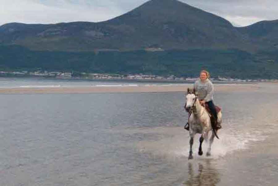 Chemistry teacher Autumn Weber rides a horse during a trip in Ireland.