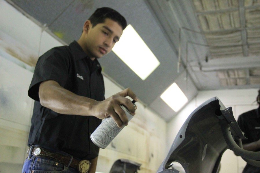 Juan Candia works in auto body at Carrigan