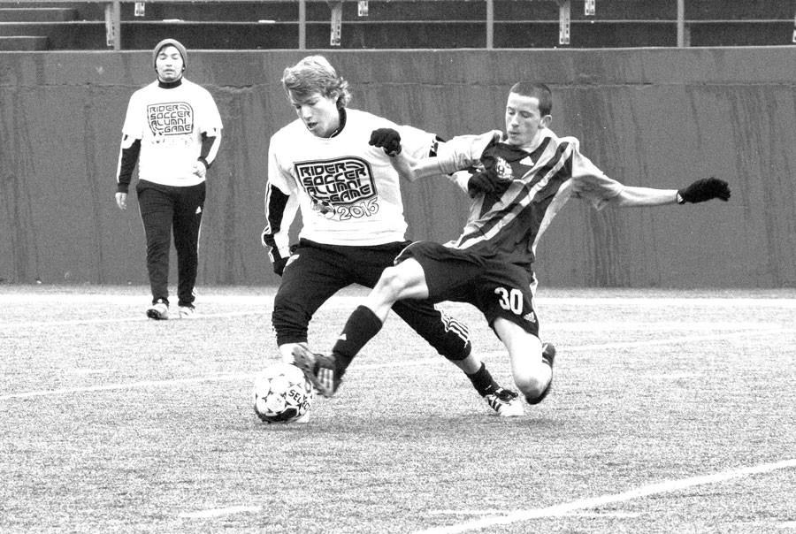 Senior Russell Catletti plays against former Rider students at the Alumni vs. Varsity game 