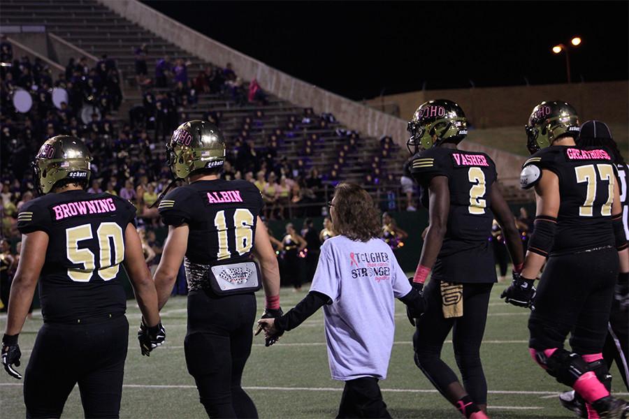 Captains Hunter Kyle and TJ Vasher take Albin’s hands, they walk together to meet the refs and begin the game with the coin toss.
“I had never been down on the field like that before,” Albin said. “It takes a special heart to do something like what Coach Bindel did.”
