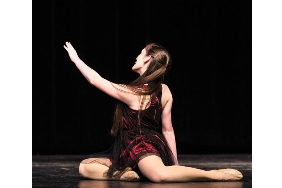 “I take dance more seriously now because I found a way to express myself.” Senior Peyton Tally finishes her solo at competition, spring 2015. 