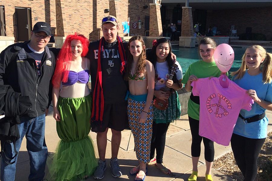 Getting ready to jump in the water, a group of students and band director Loy Studer show off their costumes. “I jumped to support the Special Olympics and the kids that participated with me,” freshman Brylee Grubb Erwin said.
