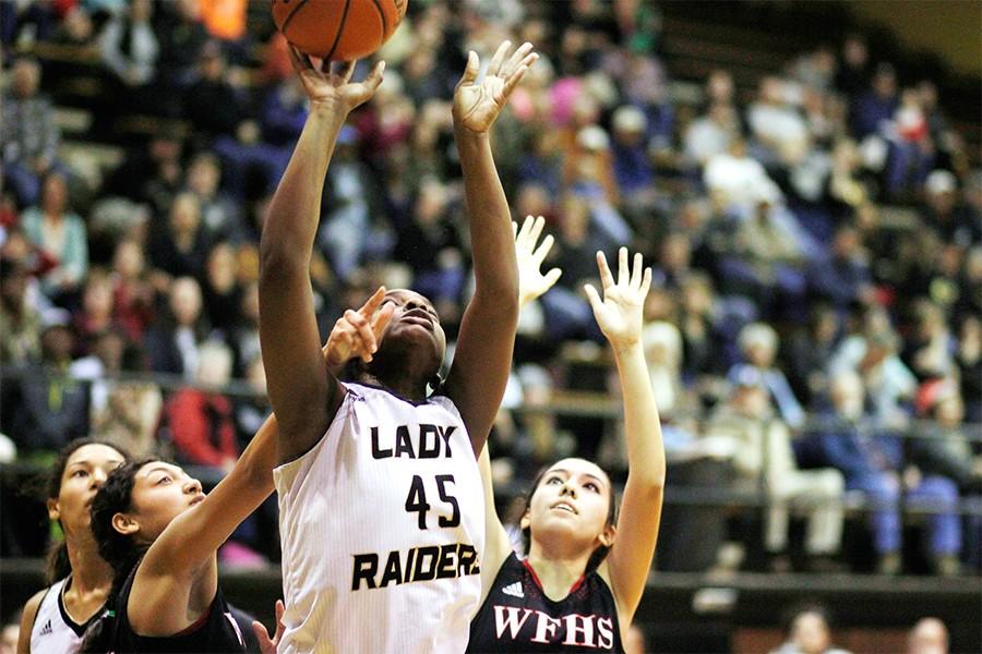 Senior Abreanna Harrison shoots the ball. I love my teammates and wish them the best of luck in their journey, Harrison said.