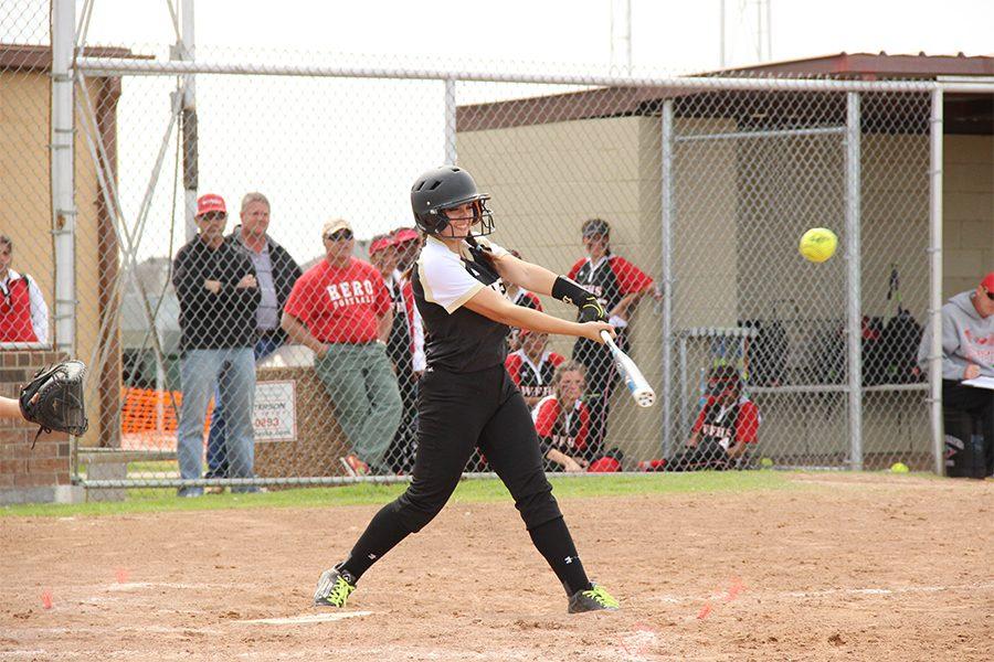 With a 19-1 victory, senior Megan Barmore hits a single against Old High.
