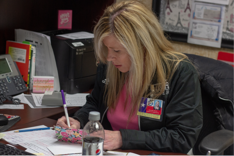 Amanda Mann working at her desk.