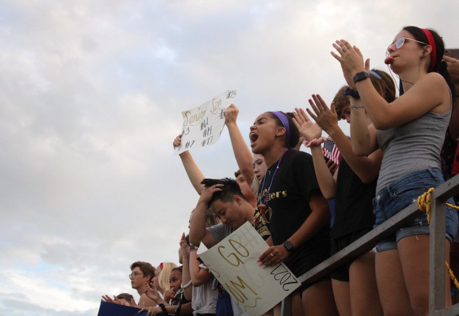 Senior Mia Bowman cheers for her team.