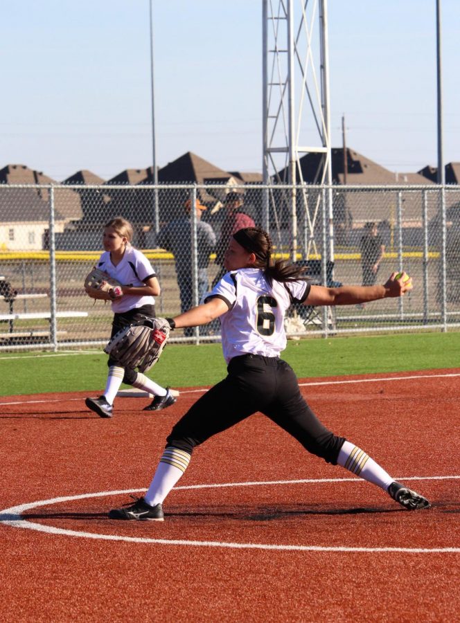 Softball pitcher sophomore Kendall Marsh warming up before a junior varsity match.