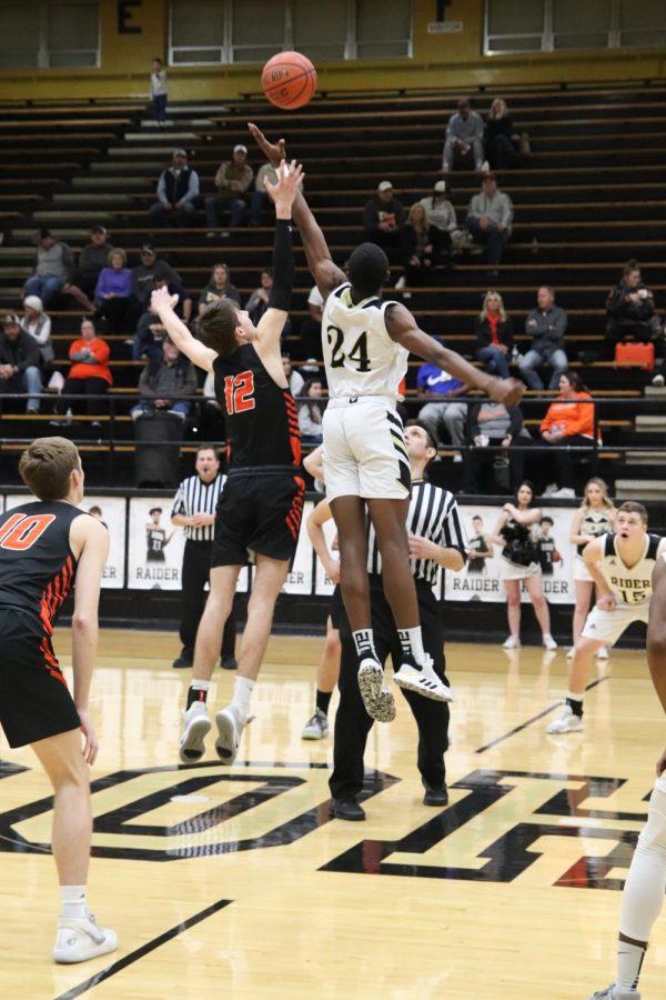 Senior Dashawn Jefferson wins the ball toss giving the Rider Raiders varsity boys the ball first.