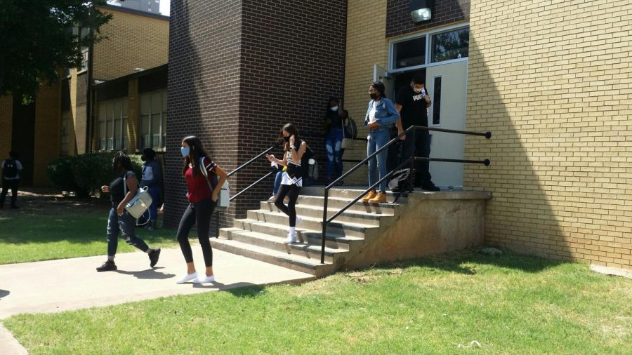 Students return to campus following safety procedures amid the coronavirus pandemic.