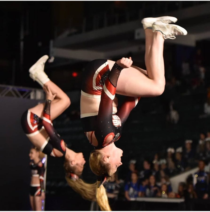 Bella Kelleher competes with her competitive cheer team
