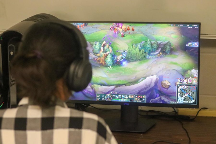 Val Valencia playing League of Legends during esports. 
