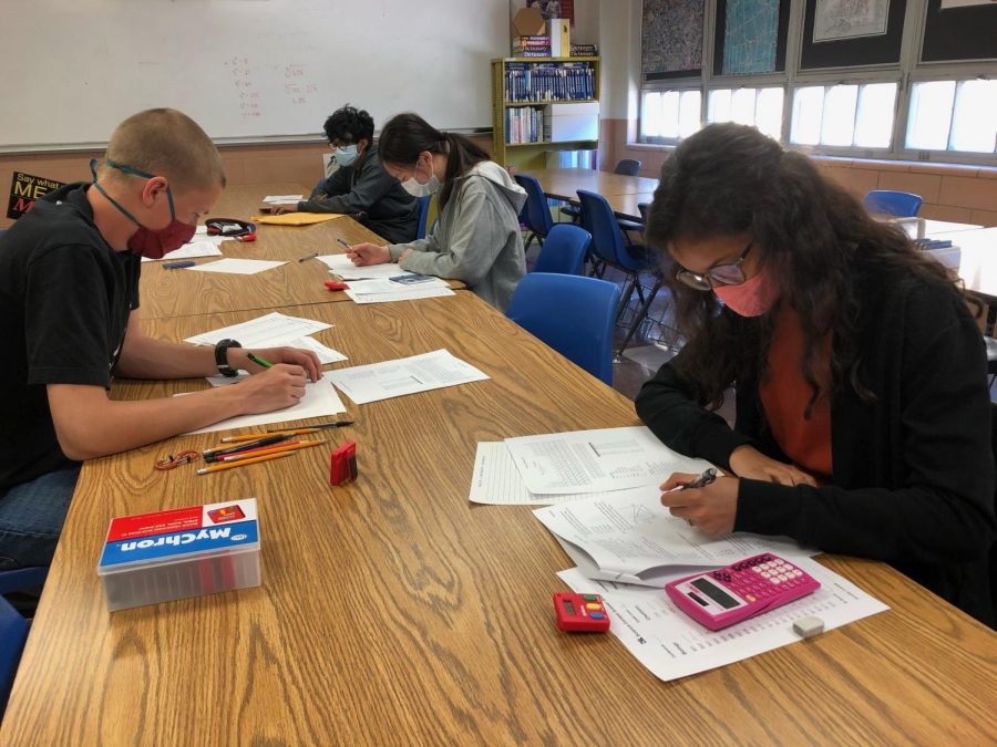 Maverick McKown and Bhargavi Chauhan compete during the District 5-5A UIL Academic Meet held March 27 on campus. 