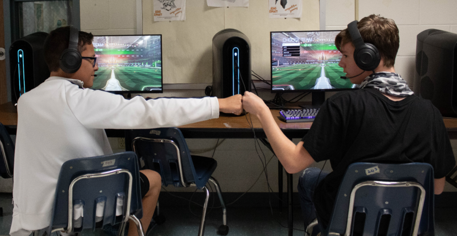 Estanislao Casas (left) and Corey Dobson celebrate during a recent esports contest. 