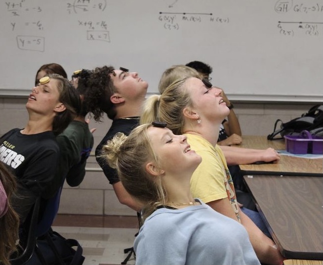 Students pictured playing game during an FCA meeting. (Bella Groves- Rider Media)