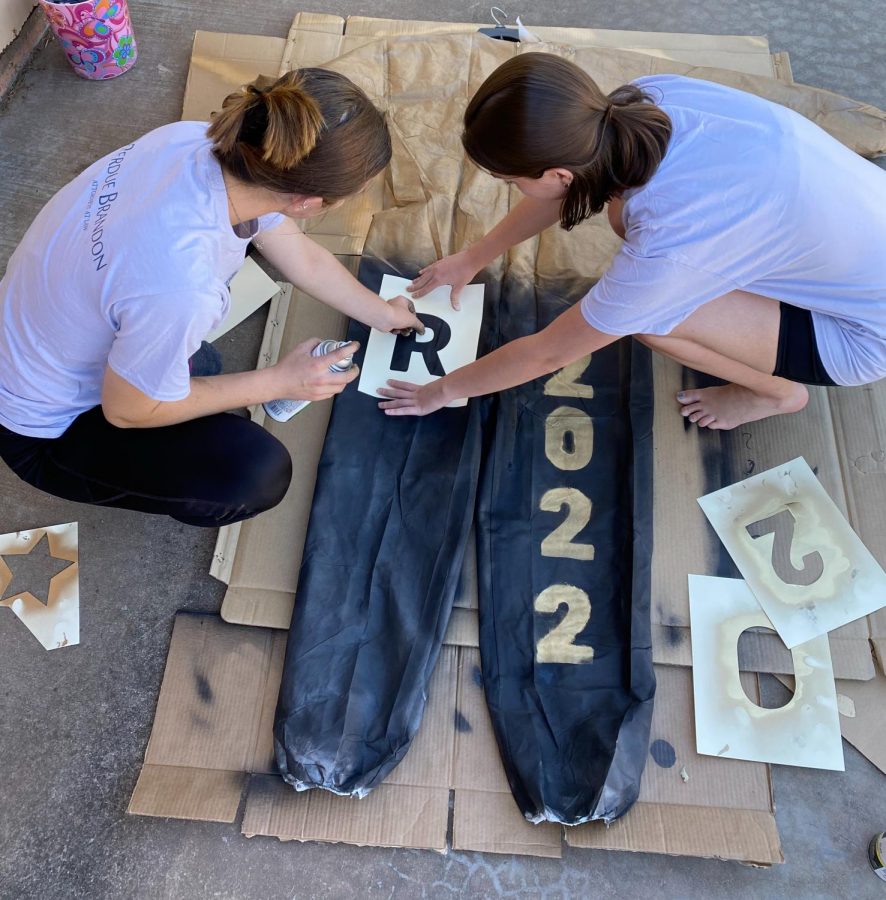 Meghan Helton and a friend work on their Yote Busters for Rider-Old High week. 