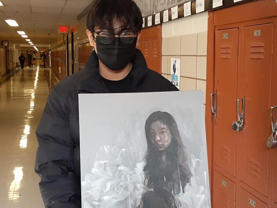 Hayden Nguyen shows off one of his pieces of art. 