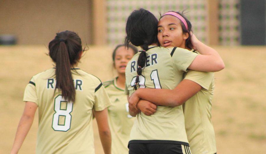 Ruth Vasquez and Aubrey Glidewell celebrate a goal from early in the season. 