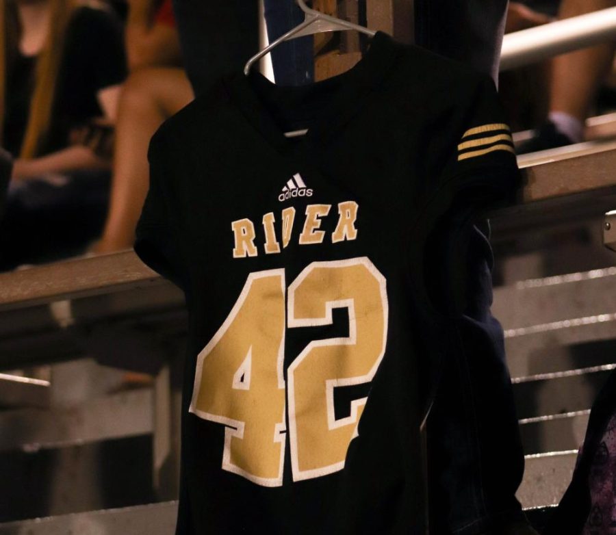 Kaleb Honeas jersey hangs down from the Memorial Stadium stands during a September football game. 