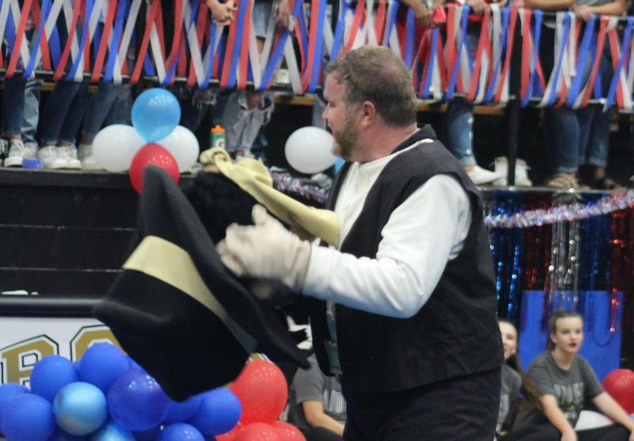 Dustin Holly takes the Rupert mascot head at last weeks pep rally. 