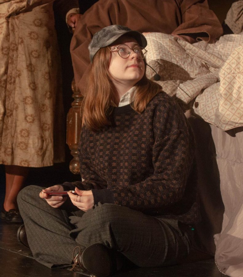 Abigail Crutchfield (Charlie Bucket) receives a bar of chocolate.