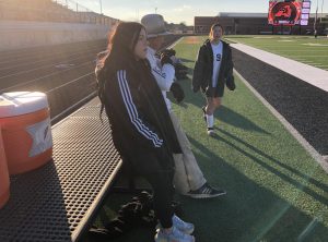 Aubrey Glidewell watches the team warm up before a district game at Aledo. 