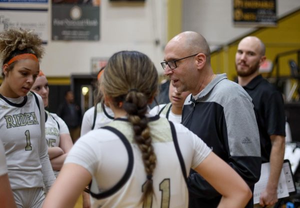 Todd Chamberlain coaching the girls basketball team.
