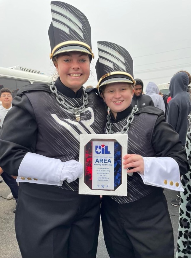 Drum majors Savannah Skelton and Emily Spurgers pose at the UIL area marching contest finals last weekend. 