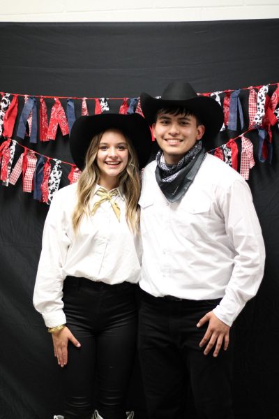 Seniors Reese Wood and Misael Vargas pose at the Round Up dance last Saturday after winning the titles of Mr. and Miss Raider. 