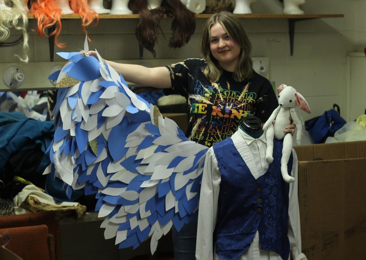 Costume designer Kylie Goins shows off one of her creations for Riders one-act play The Miraculous Journey of Edward Tulane. 