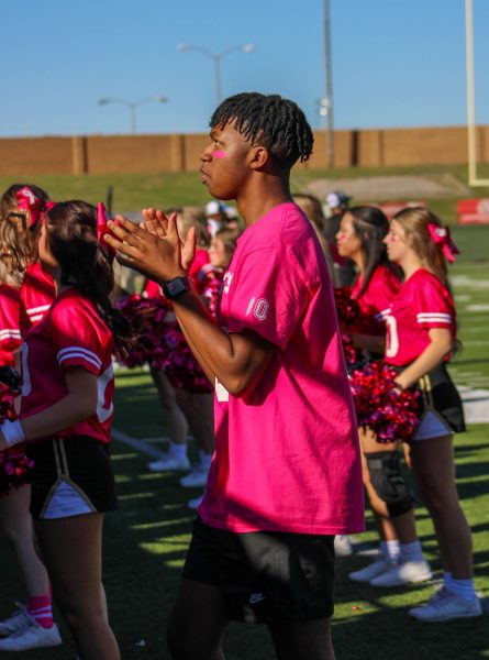 Mascot Daniel Davis cheers during a Rider football game. After spending this year as Rupert the Raider, Davis will be a cheerleader at Legacy next year. 